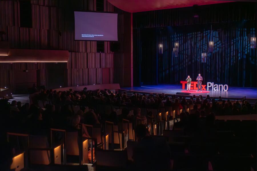 Michael Thomas and a co-presenter on the TEDxPlano stage.